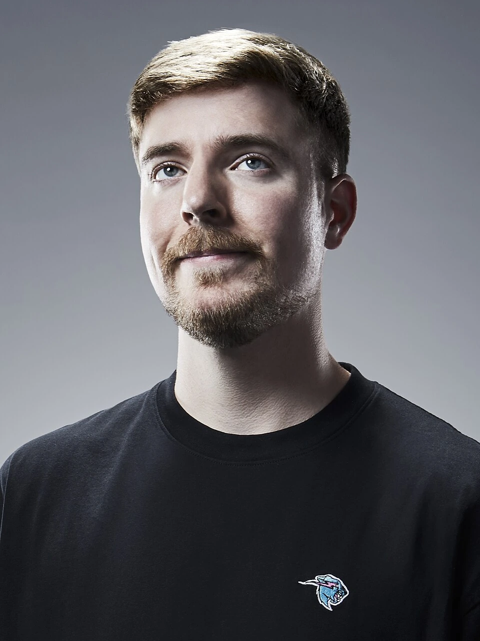 Portrait photo of Jimmy Donaldson (MrBeast) against a gray background